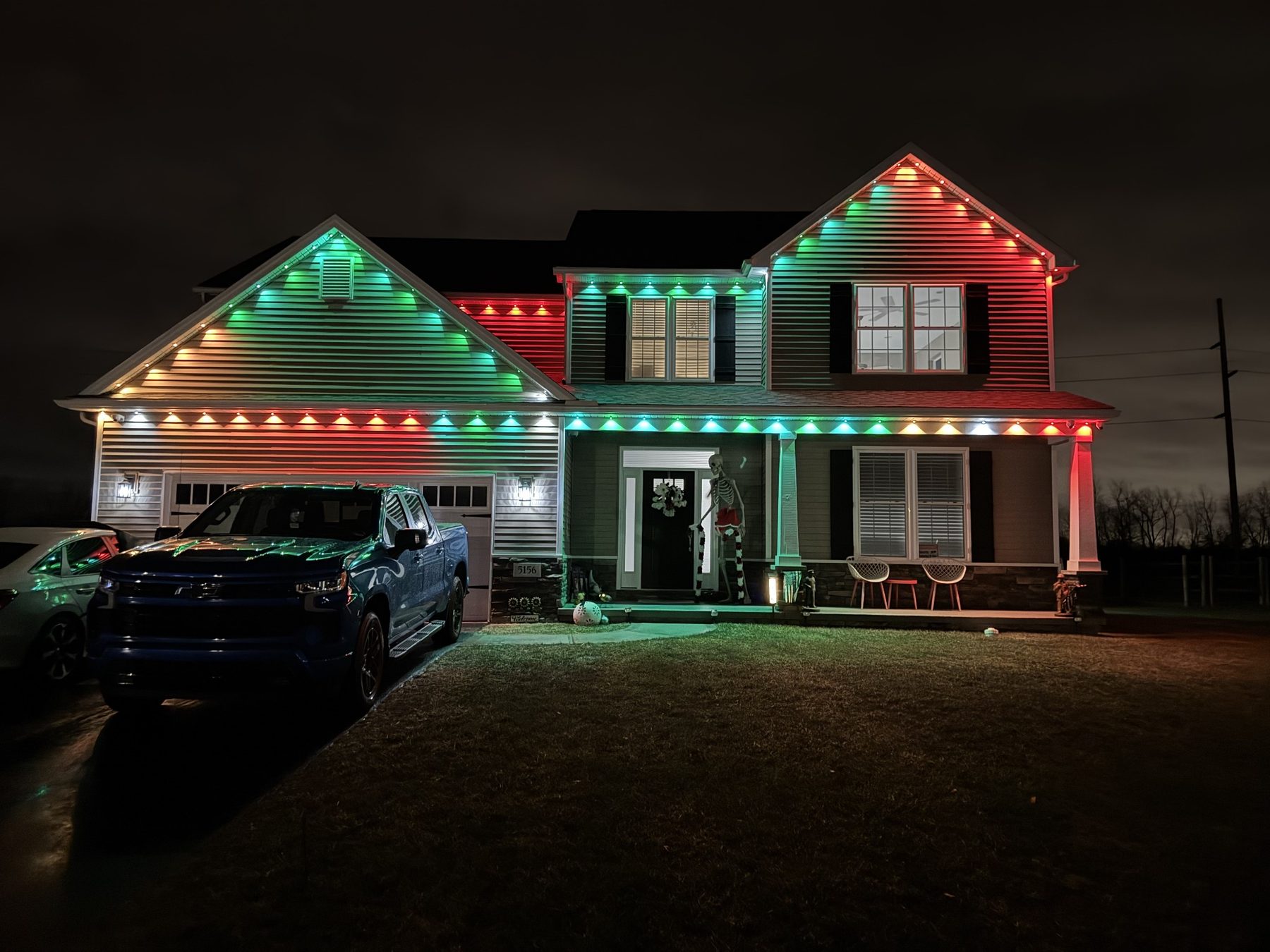 Florida home illuminated with permanent outdoor roofline lighting