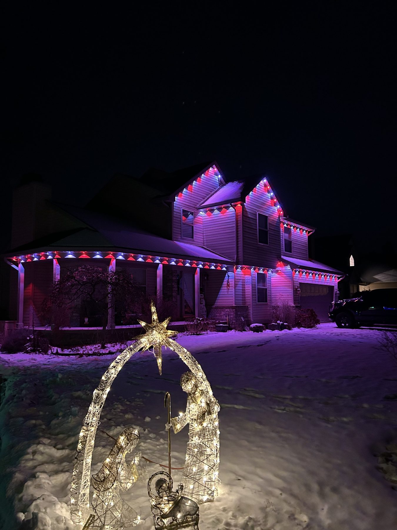 Home with warm white permanent roofline lighting